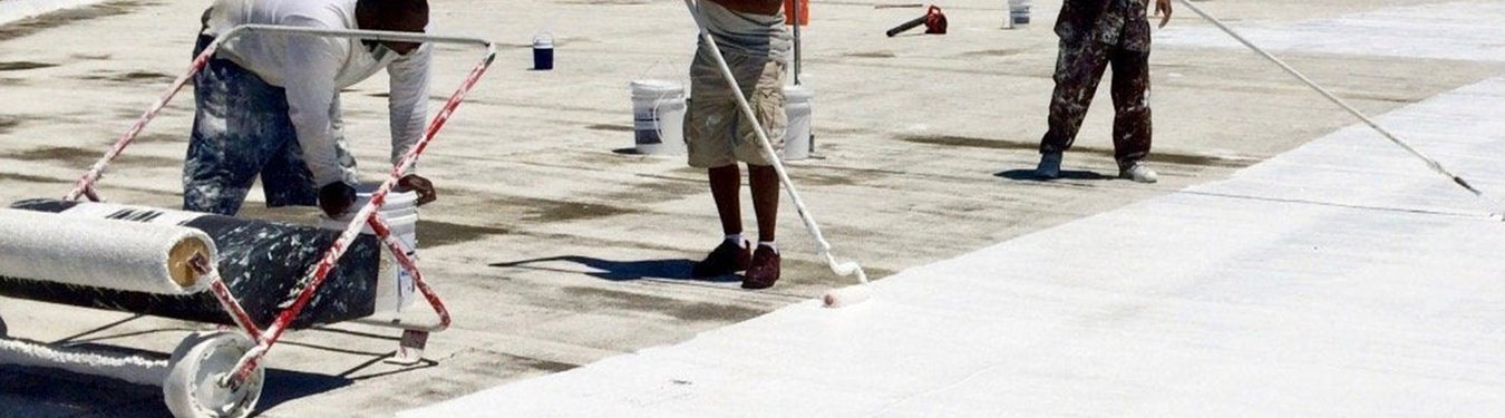 modified bitumen roof being coated with Lexis silicone coating.